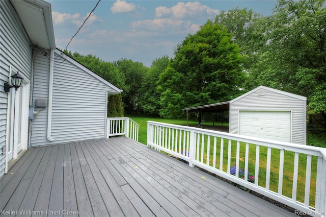 1320 W Drahner Rd, Oxford, MI 48371 - wooden terrace featuring a garage, a lawn, and an outdoor structure