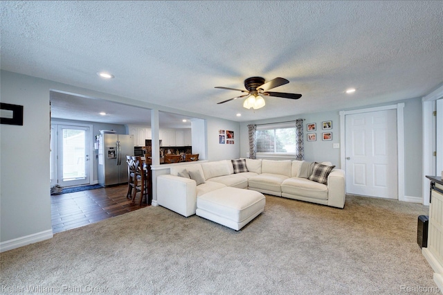 1320 W Drahner Rd, Oxford, MI 48371 - carpeted living area with a textured ceiling, recessed lighting, and ceiling fan