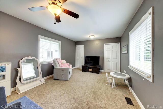 1320 W Drahner Rd, Oxford, MI 48371 - carpeted living room featuring baseboards and ceiling fan