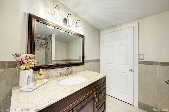 1320 W Drahner Rd, Oxford, MI 48371 - full bathroom with tile walls, vanity, tiled shower, tile patterned floors, and wainscoting