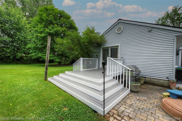 1320 W Drahner Rd, Oxford, MI 48371 - back of house featuring a yard, a deck, and a patio