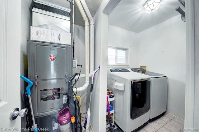1320 W Drahner Rd, Oxford, MI 48371 - washroom featuring separate washer and dryer, light tile patterned flooring, and heating unit