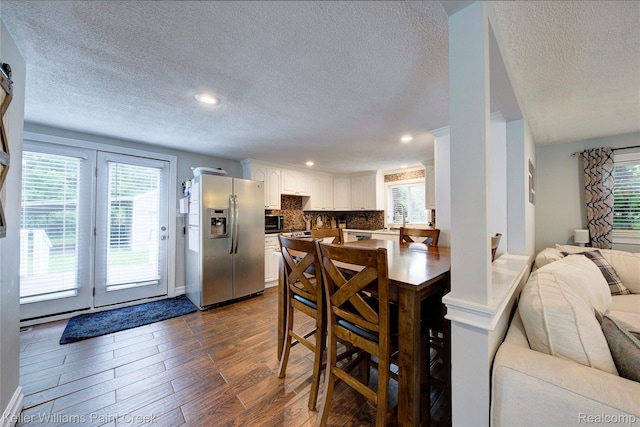 1320 W Drahner Rd, Oxford, MI 48371 - dining room featuring a textured ceiling, dark wood-type flooring, healthy amount of natural light, and recessed lighting