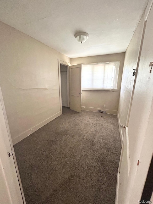 523 Grace St, Flint, MI 48503 - unfurnished bedroom with carpet floors and a closet