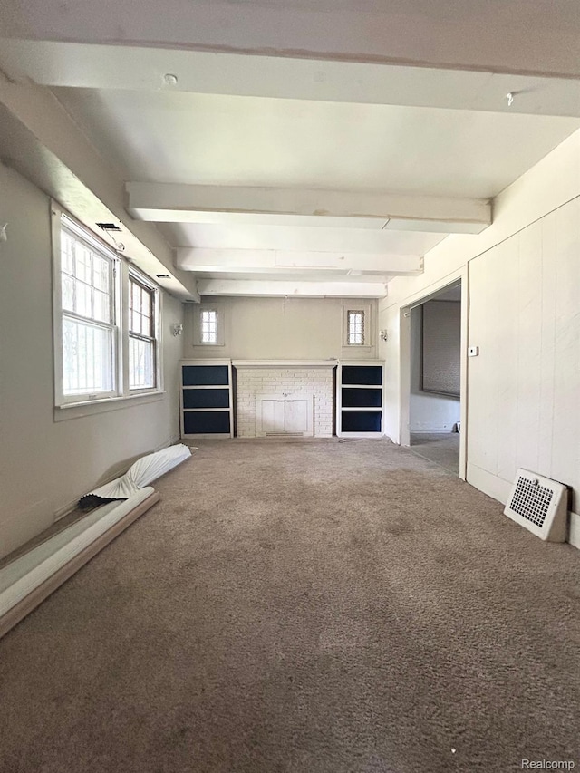 523 Grace St, Flint, MI 48503 - unfurnished living room with beam ceiling, carpet floors, and a fireplace