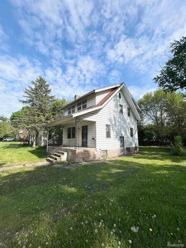 523 Grace St, Flint, MI 48503 - back of house with a porch and a yard
