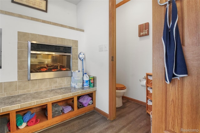 3933 Benjamin Way, Monroe, MI 48161 - bathroom with wood finished floors and a tiled fireplace
