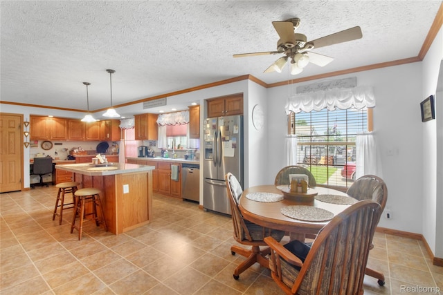 3933 Benjamin Way, Monroe, MI 48161 - dining room with plenty of natural light, ornamental molding, a ceiling fan, a textured ceiling, and light tile patterned flooring