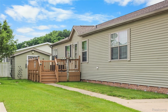 3933 Benjamin Way, Monroe, MI 48161 - back of property with a deck, a yard, and crawl space
