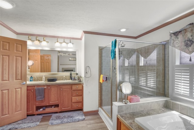 3933 Benjamin Way, Monroe, MI 48161 - full bath with ornamental molding, a shower stall, wood finished floors, double vanity, and a garden tub