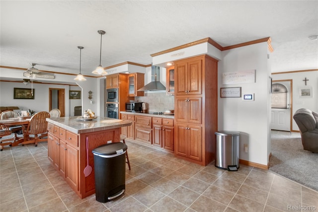 3933 Benjamin Way, Monroe, MI 48161 - kitchen with stainless steel appliances, crown molding, wall chimney exhaust hood, a center island, and light tile patterned floors
