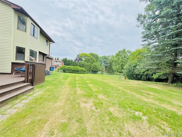 694 Robar Cir, Commerce Twp, MI 48386 - view of grassy yard featuring a wooden deck
