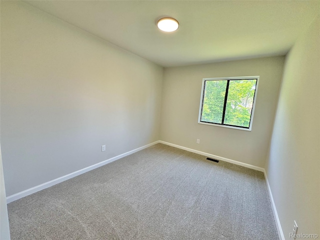 694 Robar Cir, Commerce Twp, MI 48386 - carpeted empty room featuring baseboards