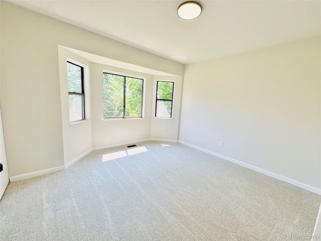 694 Robar Cir, Commerce Twp, MI 48386 - spare room featuring carpet floors and baseboards