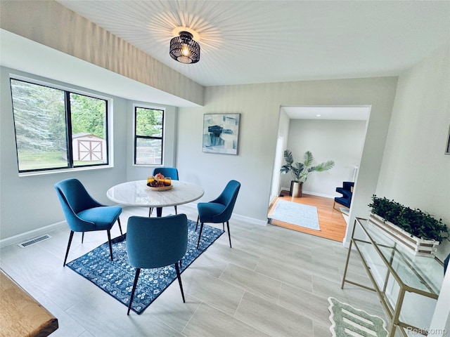 694 Robar Cir, Commerce Twp, MI 48386 - dining room featuring baseboards