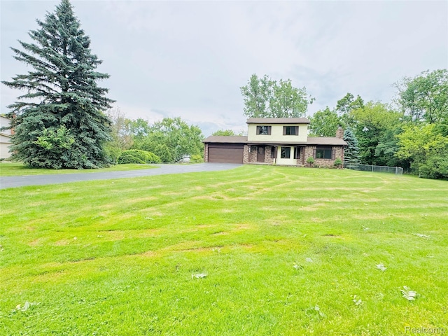 694 Robar Cir, Commerce Twp, MI 48386 - view of front of property with driveway, a chimney, and a garage
