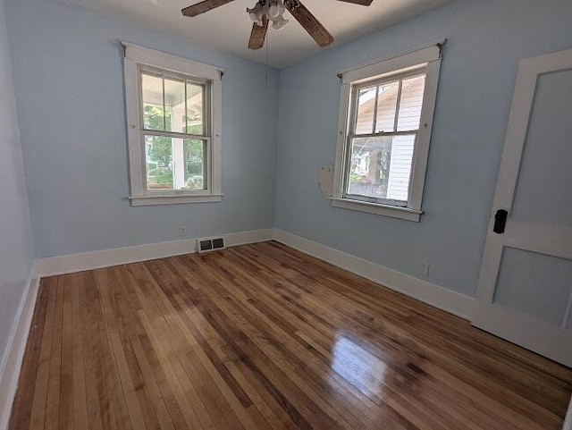 1212 Climax St, Lansing, MI 48912 - spare room with hardwood / wood-style flooring, healthy amount of natural light, and a ceiling fan