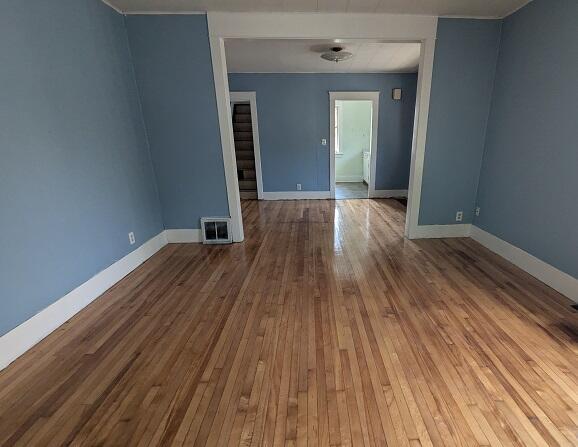 1212 Climax St, Lansing, MI 48912 - spare room with hardwood / wood-style floors and baseboards