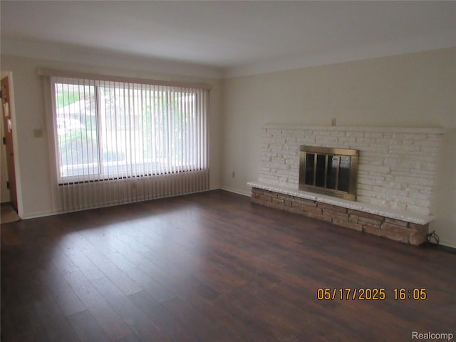 5962 Mcmillian St, Dearborn Heights, MI 48127 - unfurnished living room with wood finished floors and a glass covered fireplace