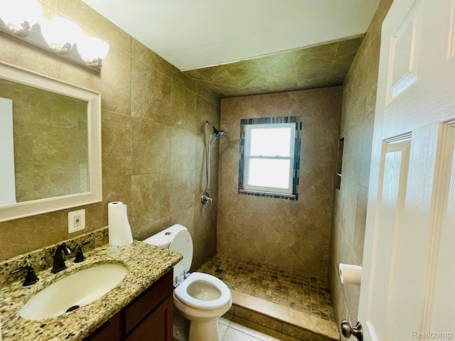 20817 Atlantic Ave, Warren, MI 48091 - full bath featuring tiled shower, vanity, and tile patterned flooring