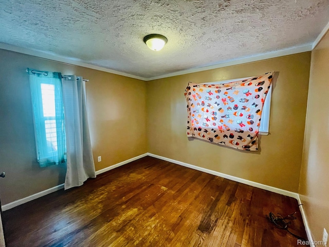 20817 Atlantic Ave, Warren, MI 48091 - empty room featuring wood finished floors, crown molding, and a textured ceiling