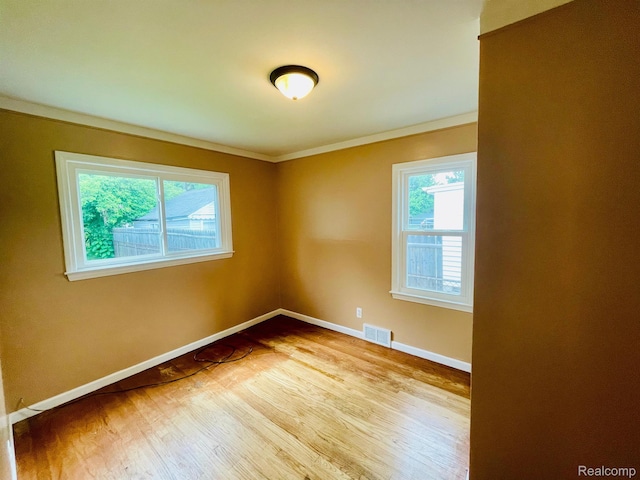 20817 Atlantic Ave, Warren, MI 48091 - empty room featuring ornamental molding and wood finished floors