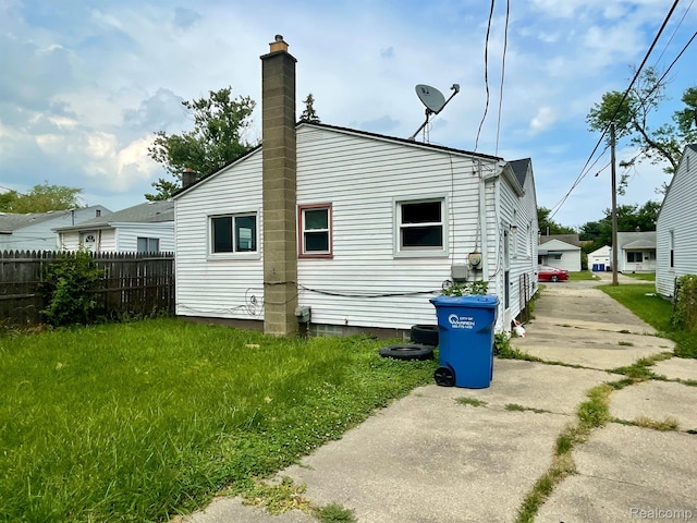 20817 Atlantic Ave, Warren, MI 48091 - rear view of house featuring a chimney