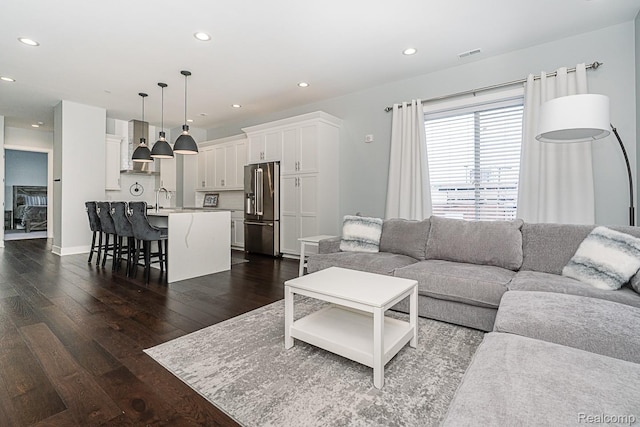 1021 S Washington Ave Unit G, Royal Oak, MI 48067 - living area featuring dark wood finished floors and recessed lighting
