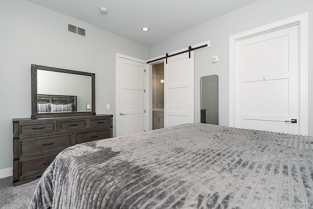 1021 S Washington Ave Unit G, Royal Oak, MI 48067 - bedroom with a barn door and recessed lighting