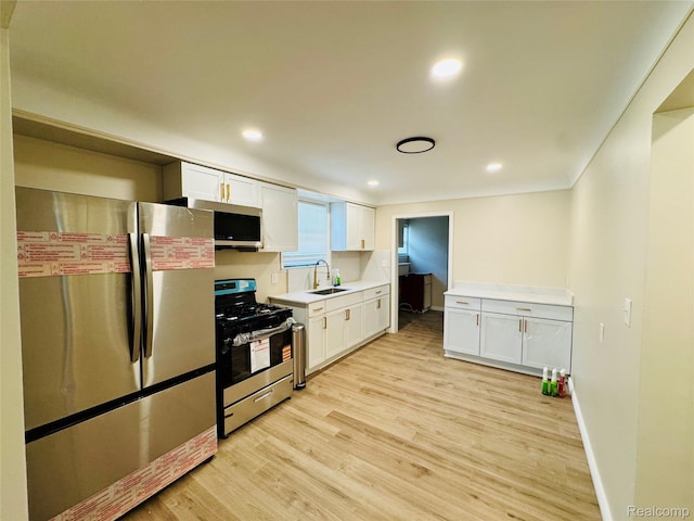 14276 Hobart Ave, Warren, MI 48089 - kitchen with stainless steel appliances, light wood-type flooring, white cabinets, light countertops, and recessed lighting
