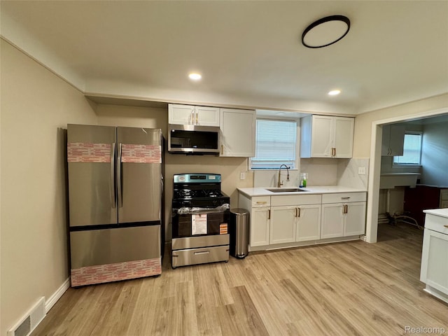 14276 Hobart Ave, Warren, MI 48089 - kitchen with stainless steel appliances, light wood finished floors, light countertops, and recessed lighting