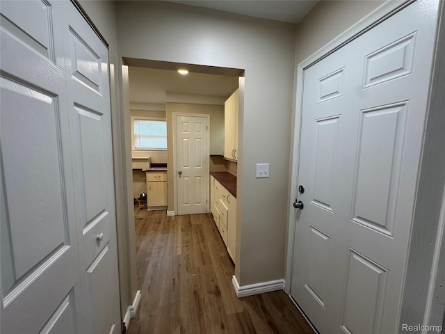 14276 Hobart Ave, Warren, MI 48089 - hallway featuring dark wood finished floors and baseboards