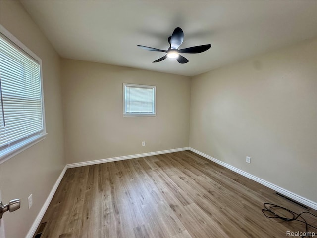14276 Hobart Ave, Warren, MI 48089 - unfurnished room with wood finished floors and a ceiling fan