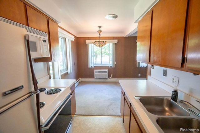 3400 Elizabeth Dr Unit 4, Trenton, MI 48183 - kitchen with white appliances, brown cabinetry, light carpet, light countertops, and decorative light fixtures