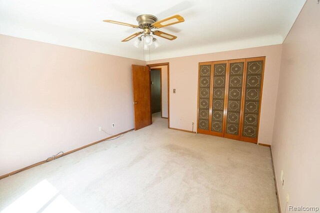 3400 Elizabeth Dr Unit 4, Trenton, MI 48183 - unfurnished bedroom with light colored carpet and ceiling fan
