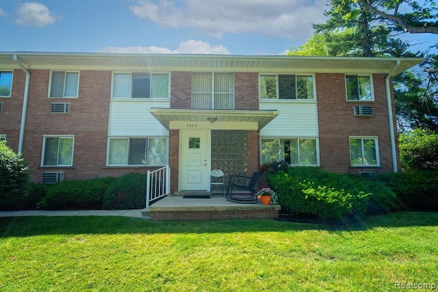 3400 Elizabeth Dr Unit 4, Trenton, MI 48183 - view of front of property featuring a front lawn and brick siding