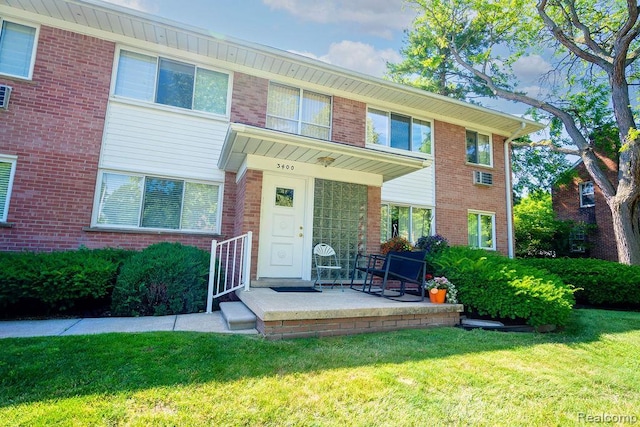 3400 Elizabeth Dr Unit 4, Trenton, MI 48183 - view of front of home with a front yard and brick siding