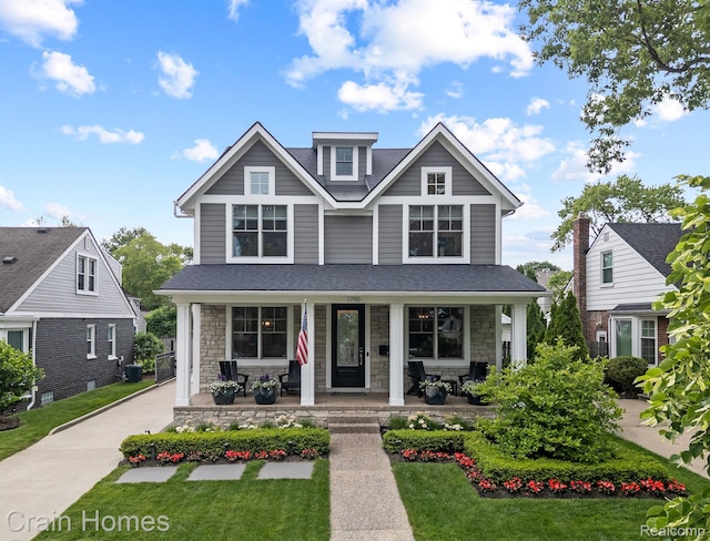 1790 Washington Blvd, Birmingham, MI 48009 - view of front facade featuring covered porch, stone siding, and a front lawn