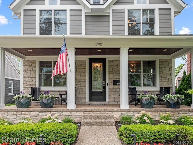 1790 Washington Blvd, Birmingham, MI 48009 - view of exterior entry with a porch and stone siding