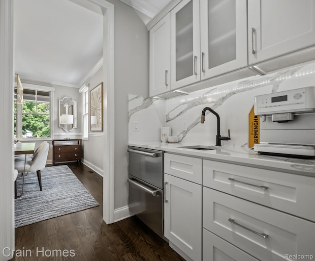 1790 Washington Blvd, Birmingham, MI 48009 - kitchen with ornamental molding, white cabinetry, glass insert cabinets, dark wood-type flooring, and dishwasher