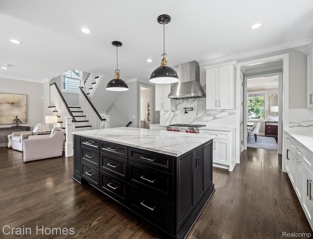 1790 Washington Blvd, Birmingham, MI 48009 - kitchen with wall chimney exhaust hood, dark cabinets, white cabinets, backsplash, and ornamental molding