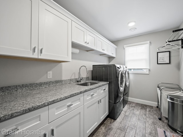 1790 Washington Blvd, Birmingham, MI 48009 - laundry room with washer and clothes dryer, cabinet space, and wood tiled floors