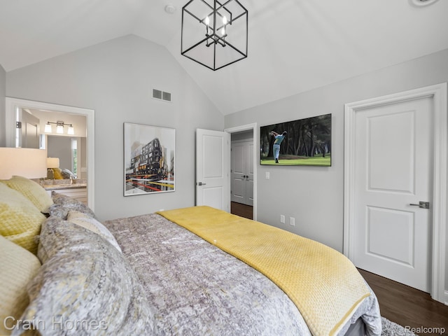 1790 Washington Blvd, Birmingham, MI 48009 - bedroom with a chandelier, dark wood finished floors, high vaulted ceiling, and ensuite bathroom