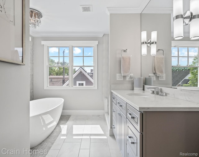 1790 Washington Blvd, Birmingham, MI 48009 - bathroom with ornamental molding, vanity, a freestanding bath, a chandelier, and marble look tile flooring