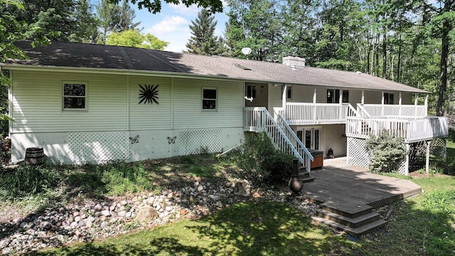 4301B W Sanborn Rd, Lake City, MI 49651 - back of house featuring a deck, stairs, and a chimney