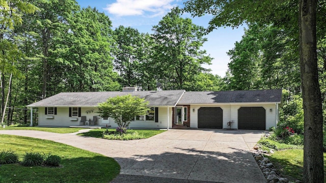 4301B W Sanborn Rd, Lake City, MI 49651 - single story home with a garage, concrete driveway, a front lawn, a porch, and a chimney