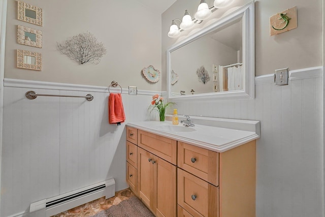 4301B W Sanborn Rd, Lake City, MI 49651 - bathroom with a baseboard heating unit, wainscoting, and vanity