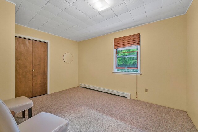 4301B W Sanborn Rd, Lake City, MI 49651 - carpeted spare room featuring a baseboard radiator