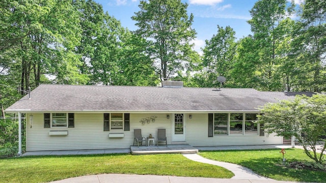 4301B W Sanborn Rd, Lake City, MI 49651 - single story home featuring a front yard, a shingled roof, and a porch