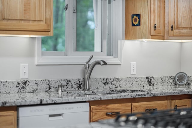 4301B W Sanborn Rd, Lake City, MI 49651 - detailed view of white dishwasher and light stone counters
